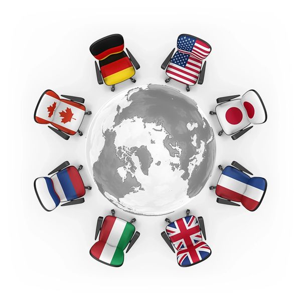Office chairs with international flags around a globe.