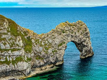 The Jurassic Coast in Dorset features the famous Durdle Door, with beaches, rocks and fossils.
