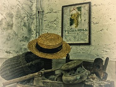 A winery on Vis, with old equipment and hat.