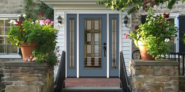 Blue door with rectangle glass insert and glass sidelites