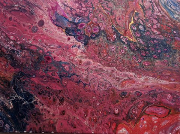 Fluid abstract acrylic pour painting artwork by derrick r kearney in red 