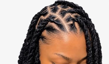 Close-up of intricate braided hairstyle with pattern.
