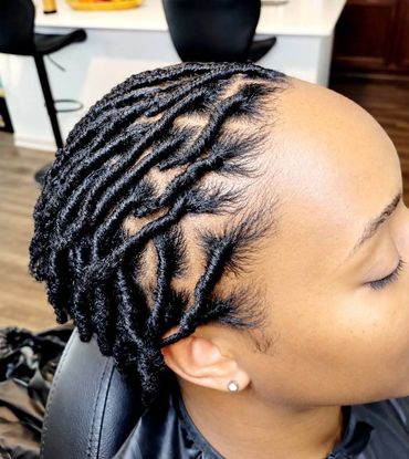 Close-up of stylish twisted dreadlocks hairstyle.