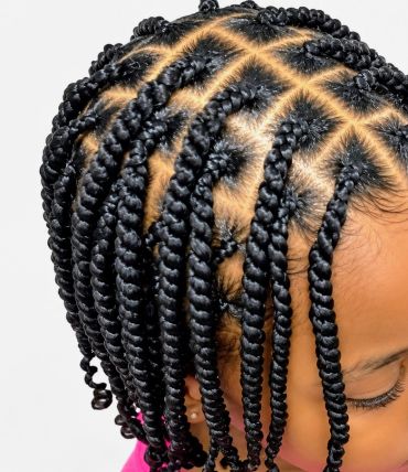 Close-up of a child's twisted protective hairstyle.