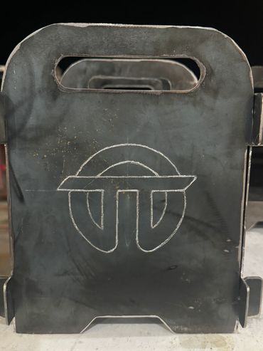 Metal target plates with a distinctive logo, aligned in a row.