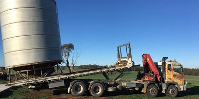Rusty Nuts Towing & Hiab moving farm machinery