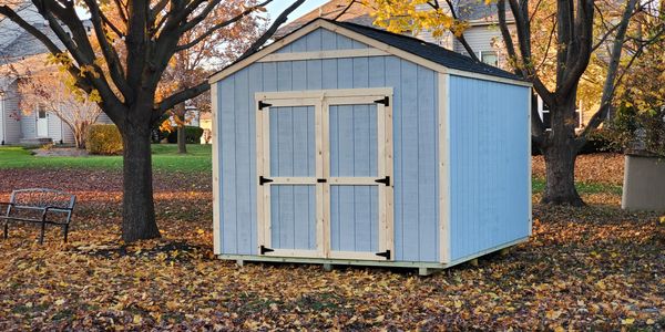 10x12 gable shed with  double doors . Primed siding . 