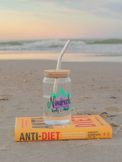 Anti-Diet by Christy Harrison book & Nourish - Body and Mind cup