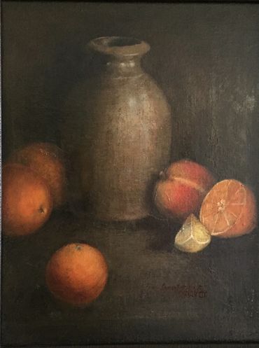 Still life of jug surrounded by oranges, a peach and lemon by Sharon Kretchmar.
