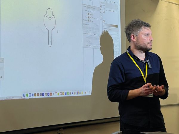 a man holding a lecture