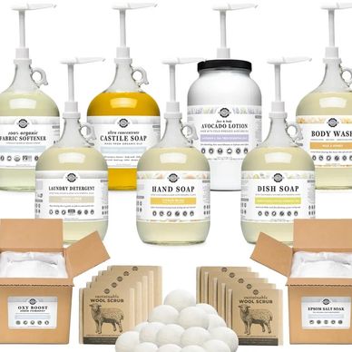 Set of organic cleaning and personal care products with eco-friendly packaging.