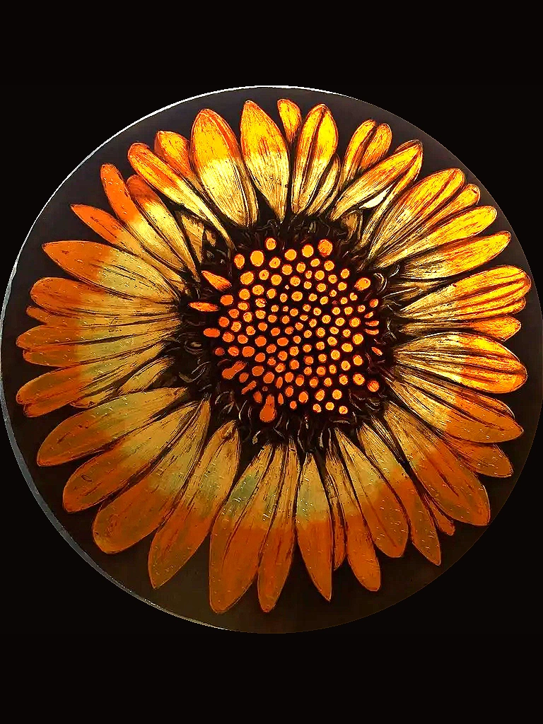 orange and yellow multi-petal flower with seed center