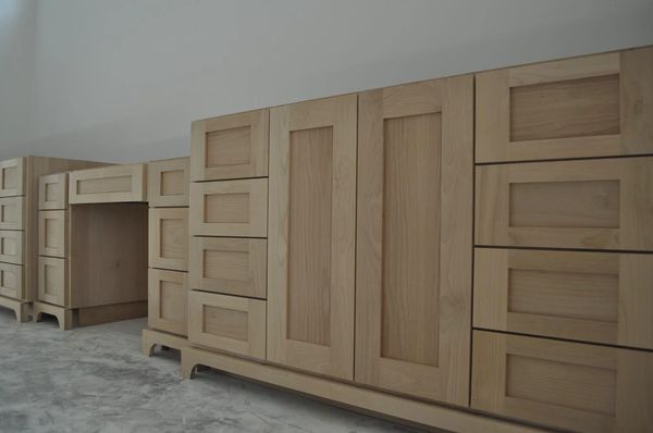 Clear alder bathroom vanity cabinet with shaker doors and drawer fronts