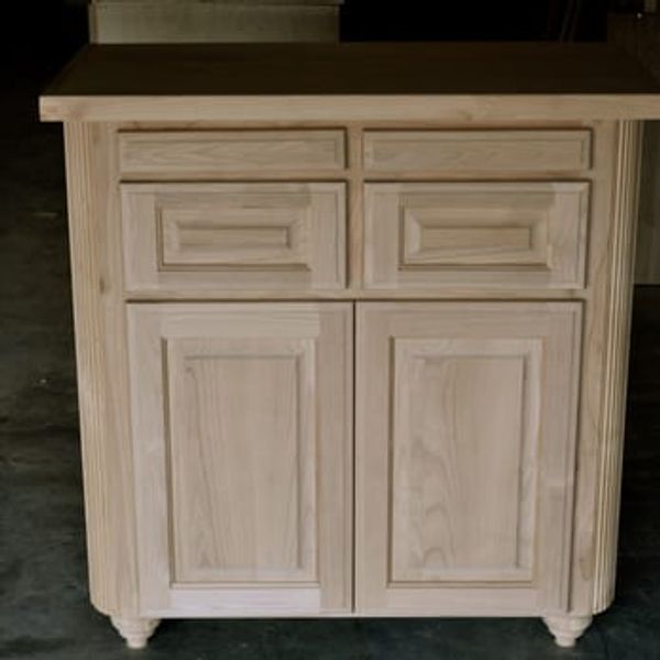 Small wet bar cabinet made from alder. The top opening is a pull out cutting board
