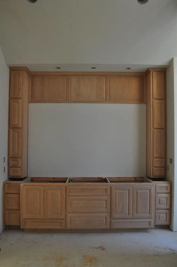 Knotty alder vanity cabinet with raised panel doors and drawer fronts