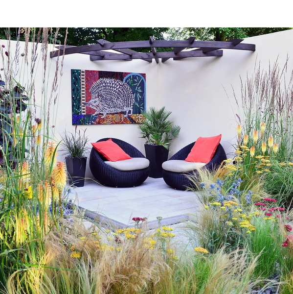 garden with rill and mosaic image of hedgehog including yellow and orange flowers