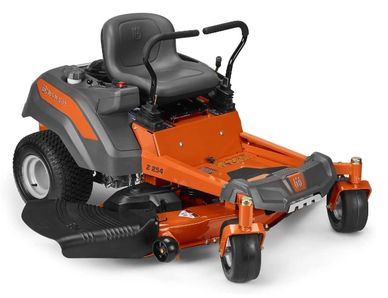 Orange and grey Husqvarna zero-turn riding lawn mower with a large cutting deck and comfortable seat