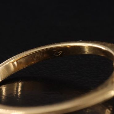 Close-up of a ring's inner engraving.