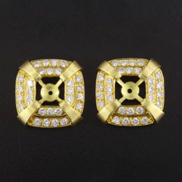 Pair of elegant gold and diamond earring settings.