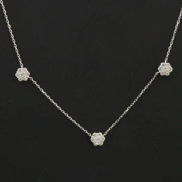Silver necklace with three flower-shaped pendants.
