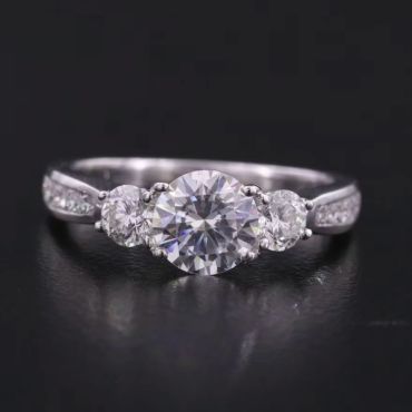 Elegant diamond ring with three main stones.