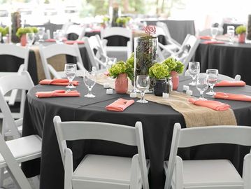 60" round tables, black linens, premium white chairs