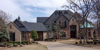 Edmond Oklahoma residential re-roof using Owens Corning Duration Storm in Onyx Black.
