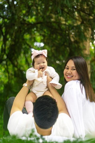 Mom and dad in park with baby
