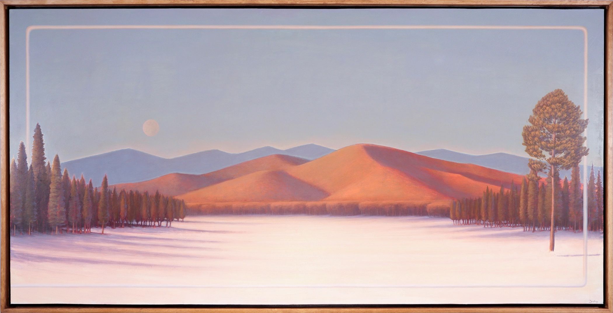 Snow field lined with trees leading to a sun lit mountain range. Bordered with a contemporary frame
