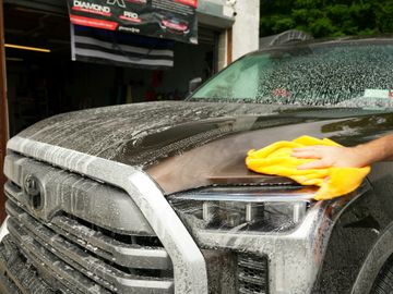 A person washing a car