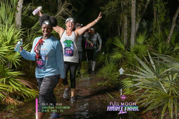 Excited runners running trails