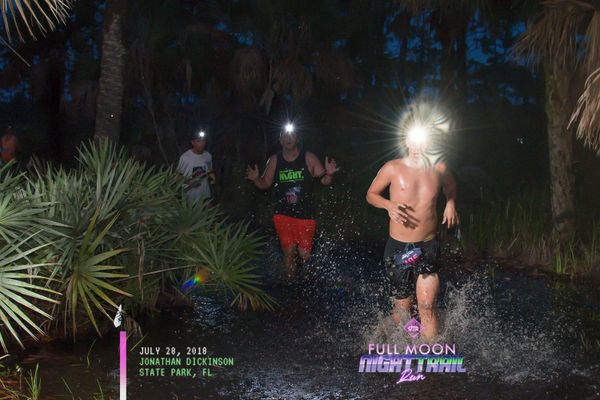 a person running trails with a headlamp