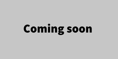 Coming soon sign on gray background.