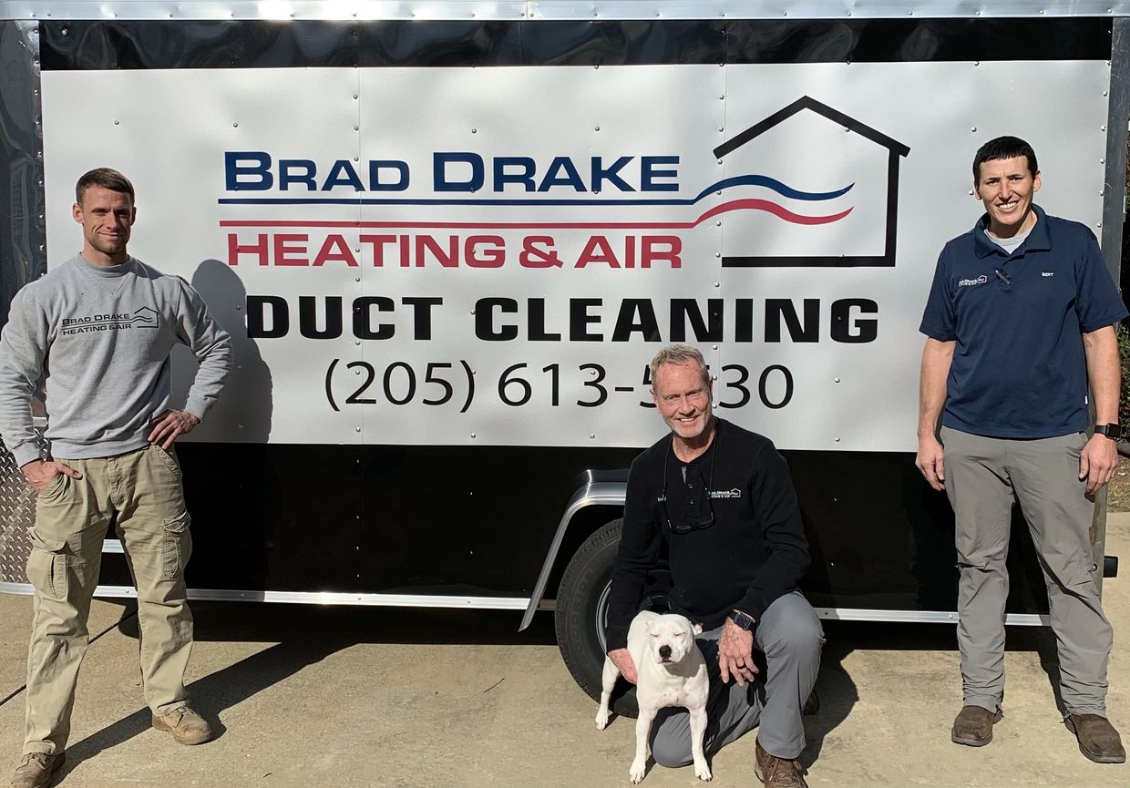 Brad Drake Service Vehicle and Team with their dog, Buddy Ray