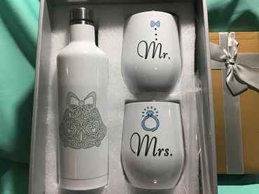 Drinkware set that includes a large tumbler and two small wine tumblers