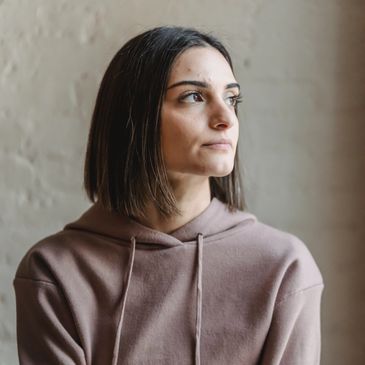 Woman showing OCD growth and development: The importance of mental health education at Psycophi