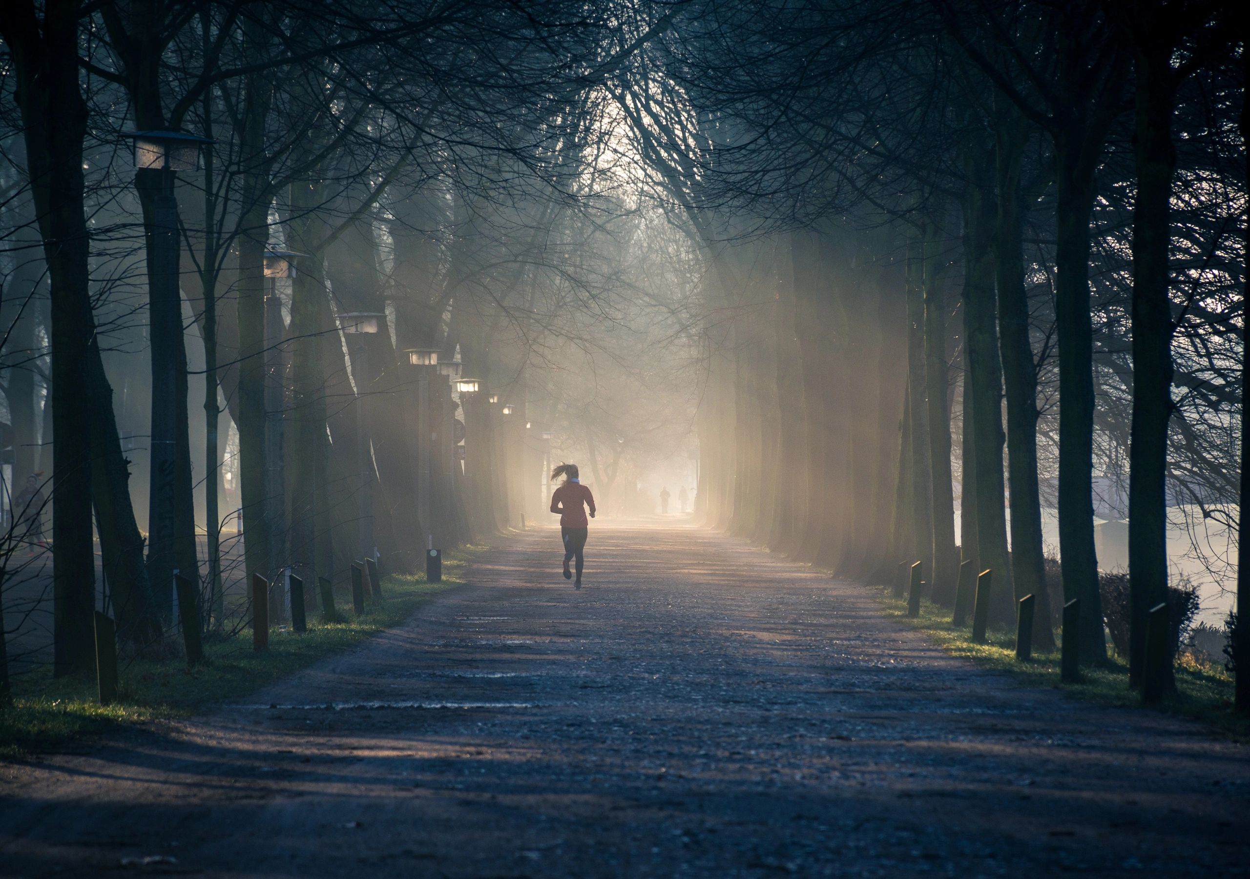 Image of a person running. Represents idea of physical activity as a tool for good mental health.