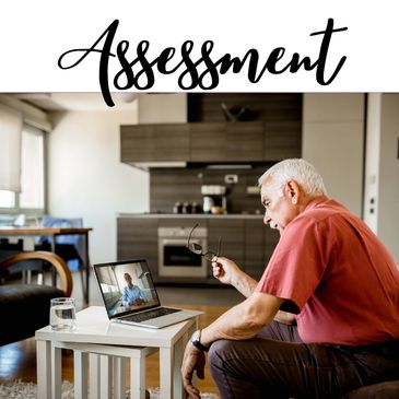 a man sitting on a couch talking to someone via on his laptop