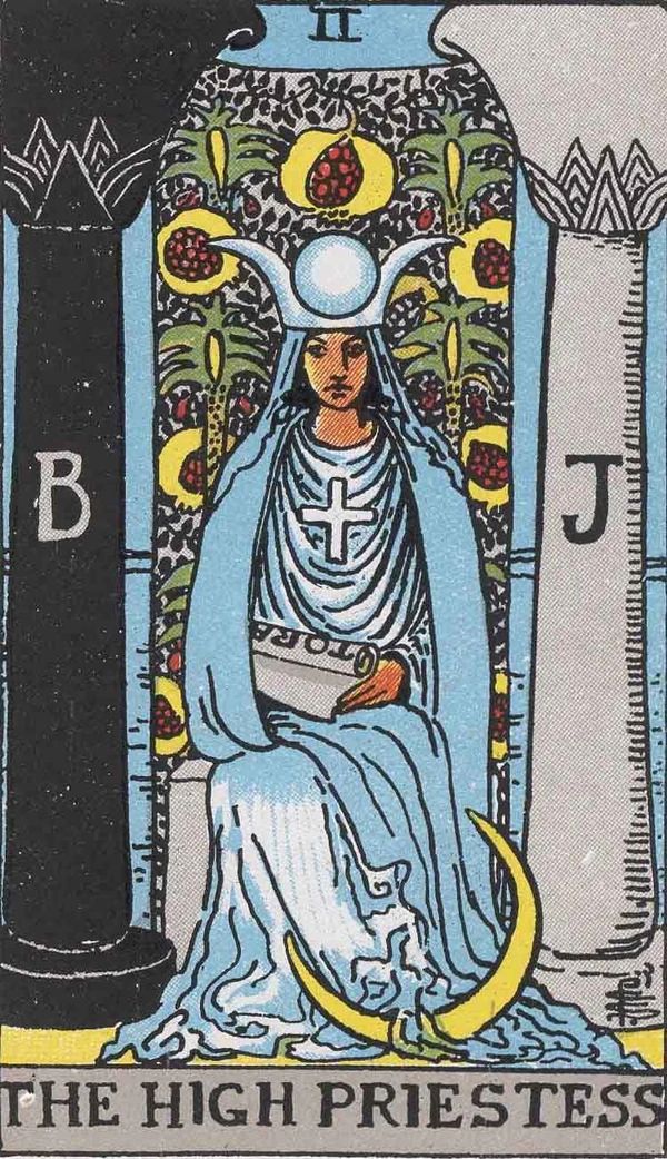 The High Priestess tarot card with illustration of a woman in a beautiful gown pictured