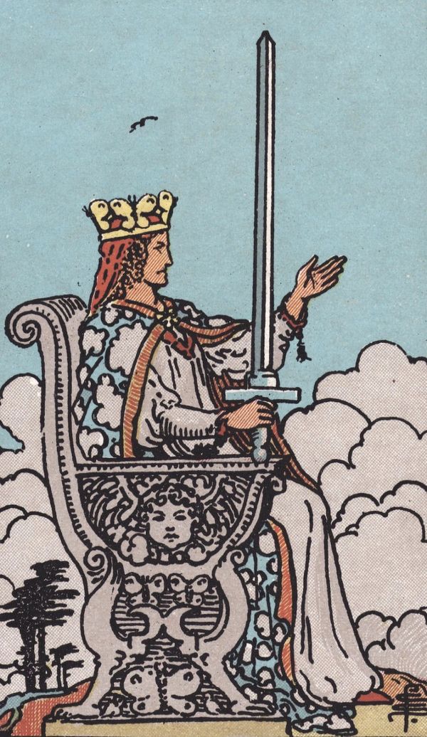 Tarot card the Queen of Swords with image or woman sitting on a throne holding a sword in the air.