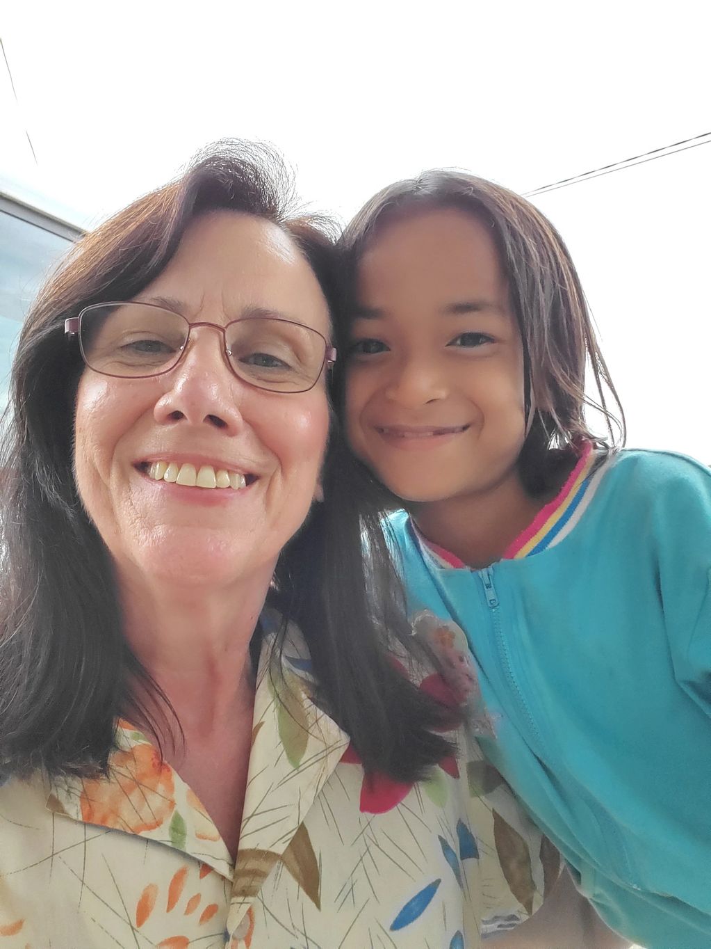 a woman and a kid is taking picture