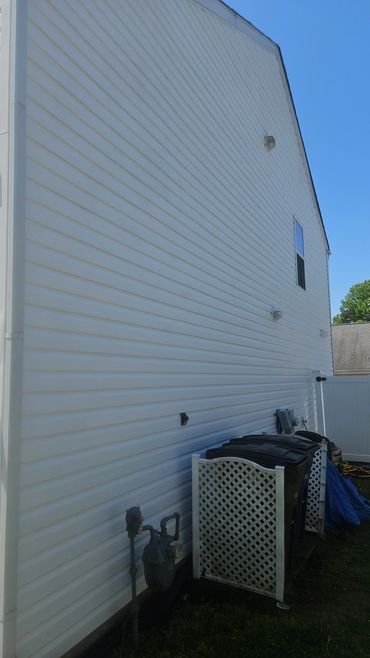 Side view of a white house, before and after, pressure washing, baker business, wayne & cory floor care and more,