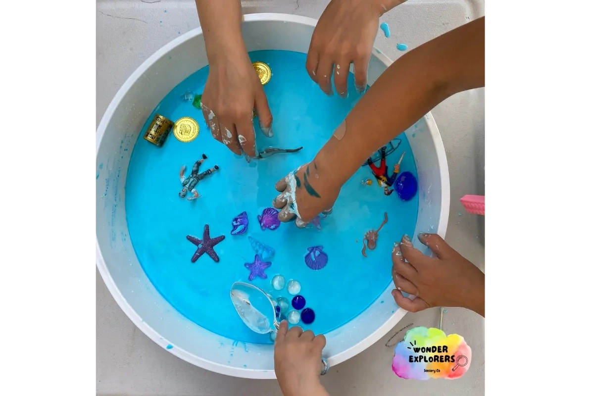 Children playing in blue sensory slime with slime. Children playing in blue sensory slime with slime.