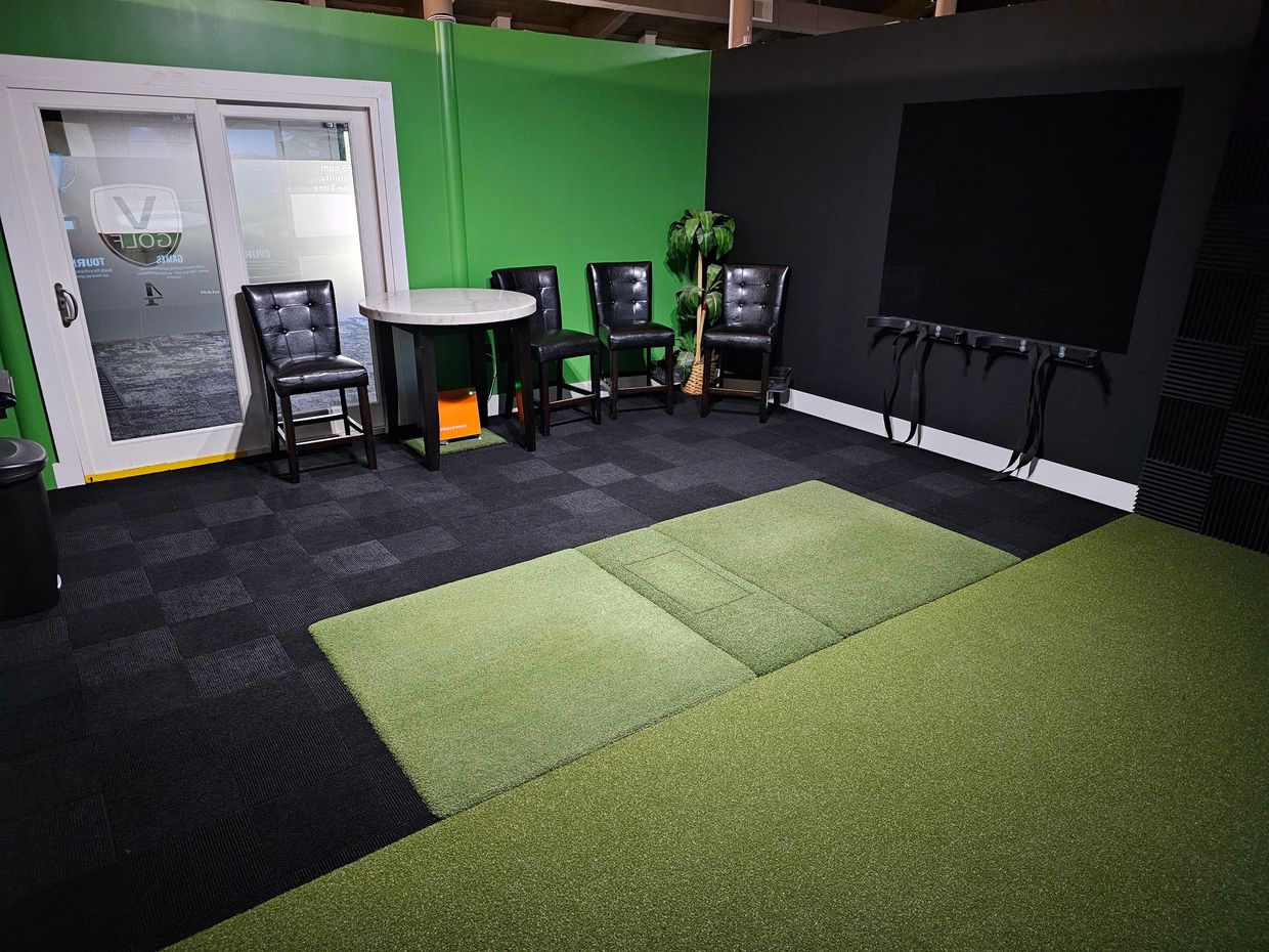 Private indoor golf simulator suite at V Golf