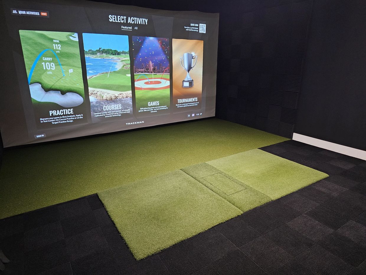 Private indoor golf simulator suite at V Golf