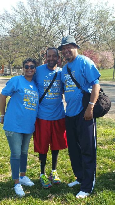 Kayla's Mom, Uncle Jeff and Dad pause for pic at the 2018 Walk to End Epilepsy