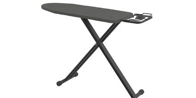 Black ironing board with metal legs and iron rest.