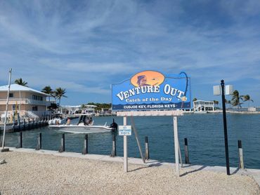 Sign for Venture Out fishing charter at Cudjoe Key, Florida Keys.