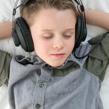 Advance Brain Technologies The Listening Program Boy listening with headphones