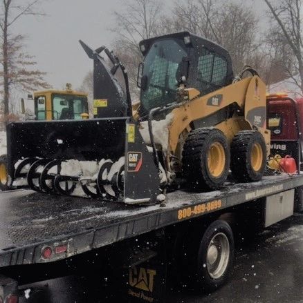 Construction rental equipment towing and transport by American Towing in Worcester Massachusetts 